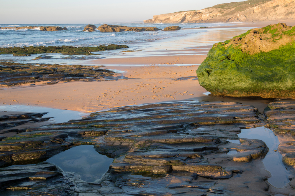 Rock Pool and Sandy Beach with Seaweed, Portugal; Europe